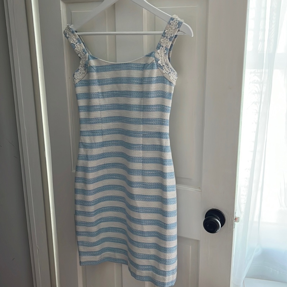 Light blue and white dress with silver threading and daisy appliqué.